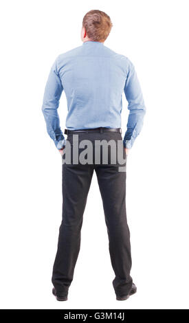 Vue arrière de l'homme d'affaires à Red shirt se tourne vers l'avenir. Jeune homme d'observation. Vue arrière Vue arrière. collection les gens de personne. Plus isolé sur fond blanc. avec un employé de bureau sports figure regarde ailleurs Banque D'Images