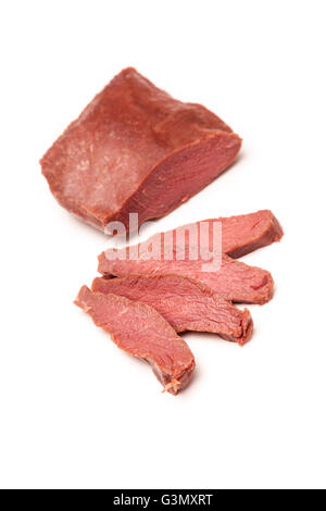 D'Autruche cuit (Struthio camelus) steaks de viande isolated on a white background studio. Banque D'Images