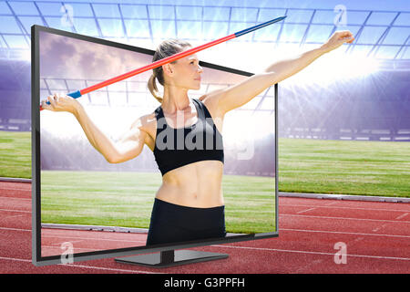 Image composite de vue de face de la sportive la pratique du javelot Banque D'Images