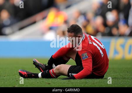 Wayne Rooney de Manchester United maintient sa cheville pendant le match Banque D'Images