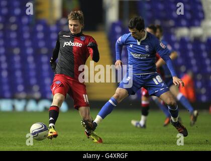 Keith Fahey (à droite) de Birmingham City et Erik Huseklepp de Portsmouth pour le ballon Banque D'Images