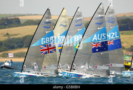 Jeux Olympiques de Londres - jour 1.Ben Ainslie, en Grande-Bretagne, pratique son canot Finn dans la baie de Weymouth.Sa première course compétitive est demain. Banque D'Images