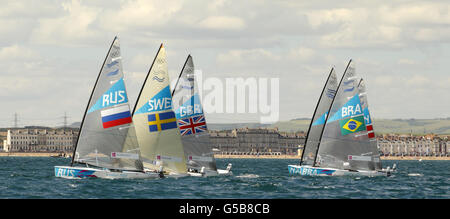 Ben Ainslie, en Grande-Bretagne, pratique son canot Finn dans la baie de Weymouth. Sa première course compétitive est demain. Banque D'Images