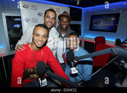 Le groupe de garçons JLS (de gauche à droite) Aston Merrygold, Marvin Humes, Ortaise Williams et Jonathan 'JB' Gill dans le studio Capital radio dans le centre de Londres pour une interview sur le Breakfast Show avec Greg Burns et Kat Shoob. Banque D'Images