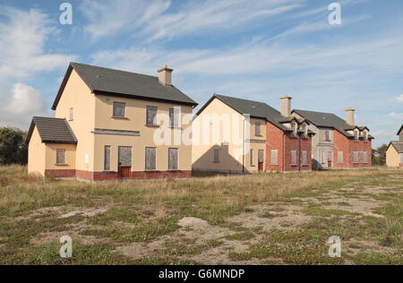 Une succession de petites maisons placardées à Wexford, Irlande. Banque D'Images