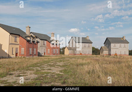 Une succession de petites maisons placardées à Wexford, Irlande. Banque D'Images