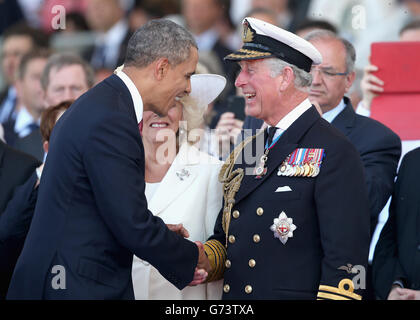 LE président AMÉRICAIN Barak Obama rencontre le prince de Galles lors d'une cérémonie internationale avec les chefs d'État à Sword Beach en Normandie pour marquer le 70e anniversaire du débarquement. Banque D'Images