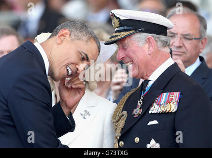 LE président AMÉRICAIN Barak Obama rencontre le prince de Galles lors d'une cérémonie internationale avec les chefs d'État à Sword Beach en Normandie pour marquer le 70e anniversaire du débarquement. Banque D'Images