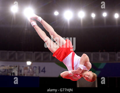 Le Nile Wilson d'Angleterre est en compétition sur le sol lors de la finale de l'équipe masculine et de la qualification individuelle à la SEE Hydro, lors des Jeux du Commonwealth de 2014 à Glasgow. Banque D'Images