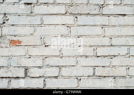 Image d'un doux fond gris mur de briques, couvert d'une couche de peinture à utiliser comme arrière-plan. Banque D'Images