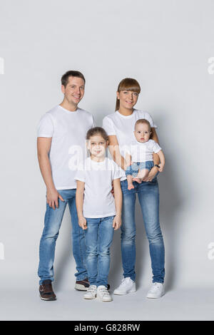 Portrait of happy family against white background Banque D'Images