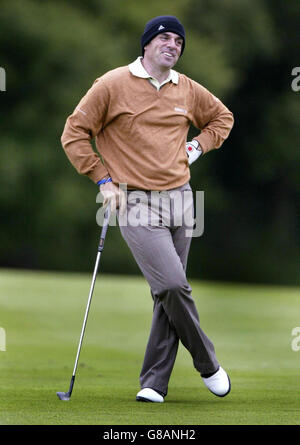 Paul McGinley, de l'Irlande, sourit après sa deuxième photo au 13ème vert. Banque D'Images