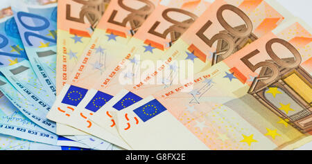 Close up de l'introduction des billets Banque D'Images