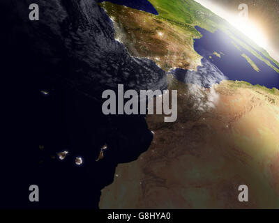 Le Maroc avec sa région pendant le lever du soleil vu de l'orbite de la Terre dans l'espace. Illustration 3D très détaillées avec réalisme Banque D'Images
