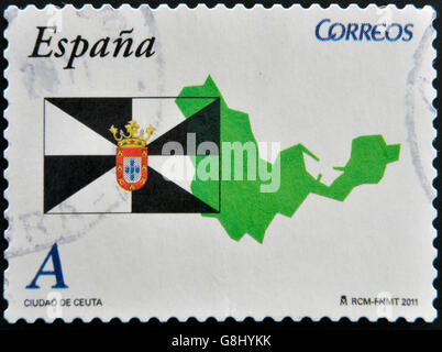 Espagne - circa 2011 : timbre imprimé en Espagne montre un drapeau et carte de la ville autonome de Ceuta, vers 2011 Banque D'Images