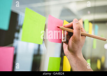 Portrait of businessman sticky notes Banque D'Images