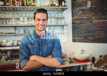 Portrait of handsome cafe owner