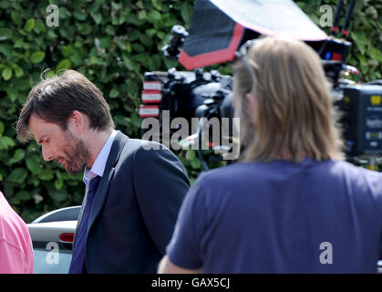 David Tennant de filmer une scène de la série finale de Broadchurch, Dorset, Angleterre, Royaume-Uni Banque D'Images