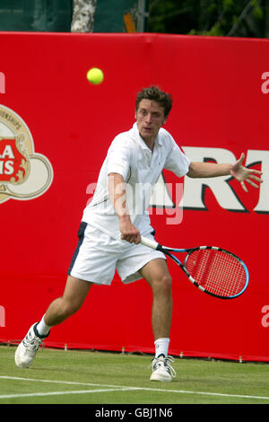 Ian Flanagan sur le chemin de la victoire sur Mark de l'Australie Philippoussis Banque D'Images