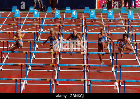 Athlétisme - Jeux Olympiques d'Athènes 2004 - Heptathlon - 100m haies femmes - Quatre Chaleur Banque D'Images