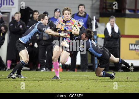 Mark Robertson d'Édimbourg a été attaqué par Graeme Morrison (à gauche) et par SRD van der Merwe (à droite) des Glasgow Warriors lors du match de la Magners League à Firhill Arena, Glasgow. Banque D'Images