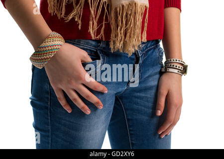 Girl's hands on blue jeans. Banque D'Images