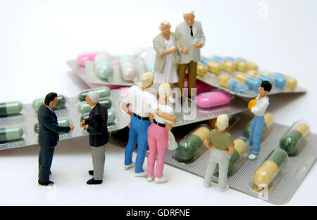 Groupe de personnes, figurines, et comprimés, comprimés Banque D'Images