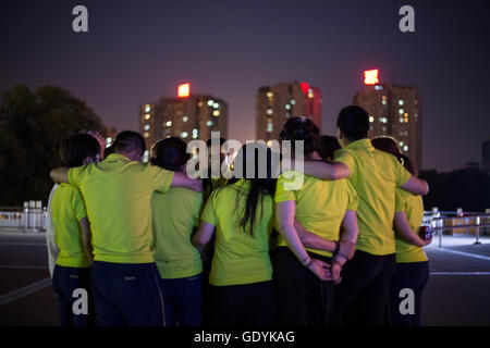 Réunion du groupe de travailleurs de nuit, à Beijing, Chine. Banque D'Images