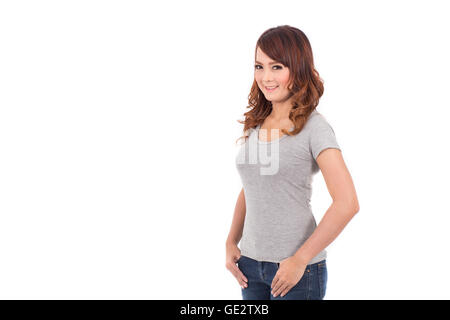 Teenage girl en blanc T-shirt gris sur fond blanc Banque D'Images