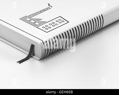 Finances concept : livre fermé, de l'industrie en s'appuyant sur fond blanc Banque D'Images