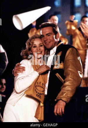 Jessica Lange, Dennis Quaid Dank des Football-Spielers talentierten Gavin Gray (Dennis Quaid) werden die im Jahr Tigres Université Louisiane 1956 Champions. Gavin Verlobte Babs (Jessica Lange) freut sich mit ihm. *** *** 1988 légende locale, tout le monde a un Banque D'Images