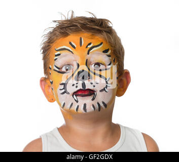 Joli garçon enfant avec la peinture du visage d'un tigre ou d'un lion Banque D'Images