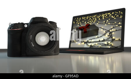 Appareil photo et ordinateur portable situé ensemble comme cadeaux de Noël 3D render Banque D'Images