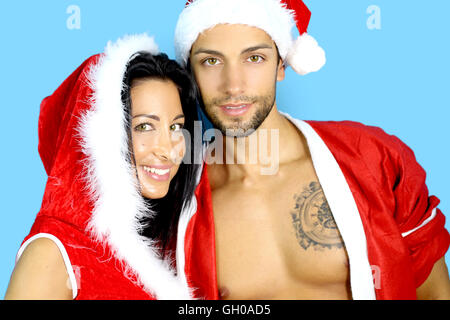 Jeune couple dressed in Santa Claus Banque D'Images