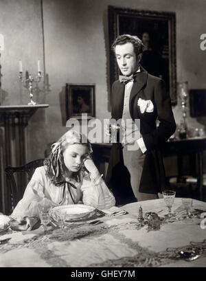 HUNGRY HILL UK 1947 B. Desmond Hurst après une querelle avec son père et son frère sur le naufrage d'une mine de cuivre sous John Hungry Hill (DENNIS PRICE) tourne tient à sa jeune sœur Jane (JEAN SIMMONS) qui a dormi sur place après les autres ont quitté la table de dîner. Regie : B. Desmond Hurst Banque D'Images