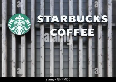 Logo de Starbucks sur un mur Banque D'Images