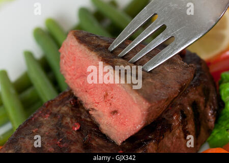 Pavé de rumsteak rôti de boeuf au poivre,carotte,sa Banque D'Images