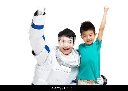 Studio shot astronautes et le petit garçon Banque D'Images