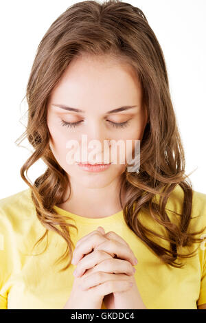 Young Pretty woman praying Banque D'Images