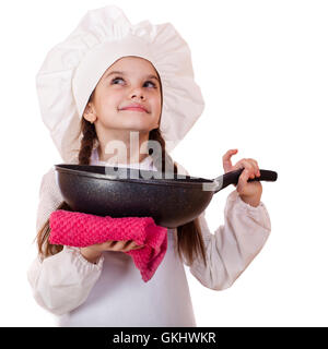 La cuisine et les gens concept - smiling little girl dans cook hat avec poêle Banque D'Images