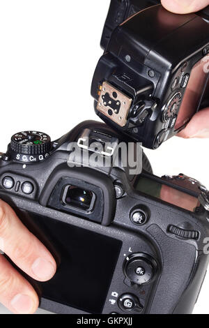 Photographe pour définir le flash externe sur un appareil photo reflex numérique Banque D'Images
