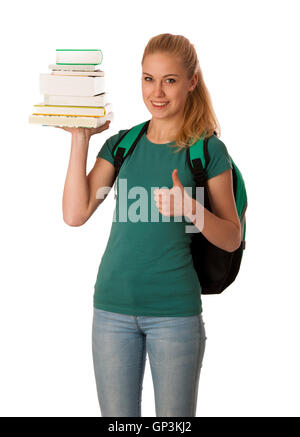 Étudiante blonde avec pile de livres sur la main et sac à dos gesturing ok signe, heureux d'acquérir des connaissances et apprendre de nouvelles choses. Banque D'Images