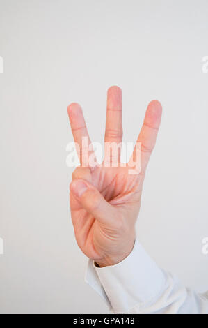 La main de l'homme l'expression de trois. Voir de très près. Banque D'Images