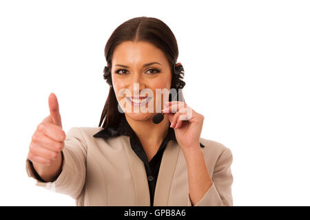 Femme avec casque et microphone travaillant en centre d'appel pour aider les clients. Banque D'Images