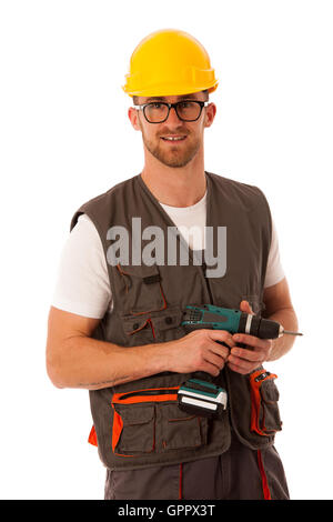 Bricolage - young cheerful man holding tournevis batterie isolated over white Banque D'Images