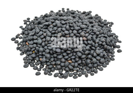 Une partie des lentilles beluga noir sur fond blanc. Banque D'Images