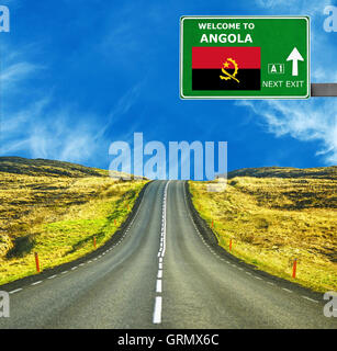 Angola road sign against clear blue sky Banque D'Images