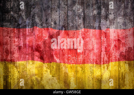 Grunge style d'Allemagne drapeau sur un mur de brique pour le fond Banque D'Images