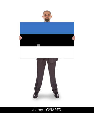 Smiling businessman holding une grande carte ou d'un drapeau Banque D'Images