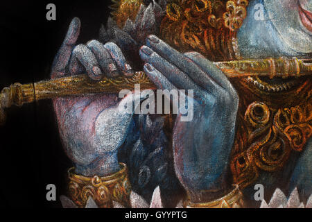 Mains du Seigneur krishna jouant de la flûte, détail avec lotus modèle. Banque D'Images